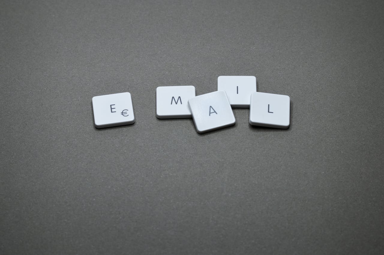 Five individual letters, similar to keyboard buttons, are arranged to form the word 'email.'